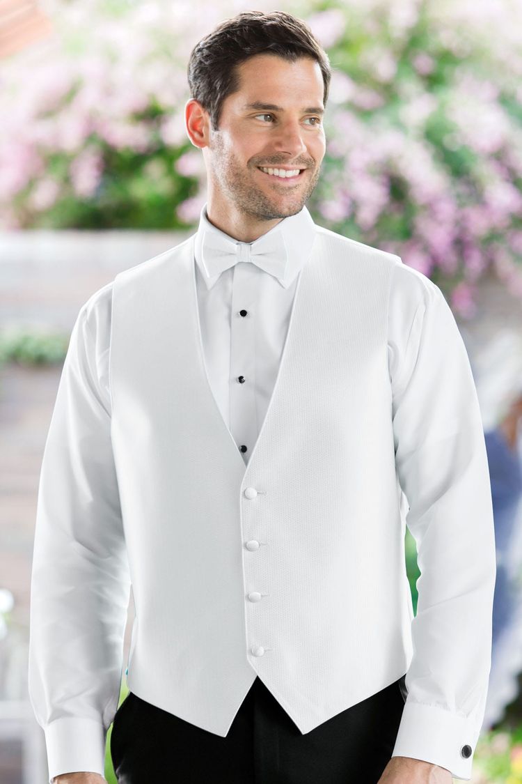 man wearing the Herringbone White Fullback Vest with a matching tie