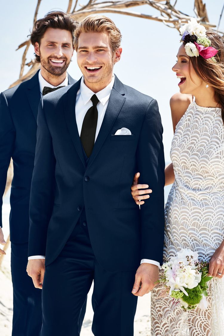 Couple laughing after the wedding in a Wedding Suit Navy Michael Kors Sterling with Black Windsor Tie