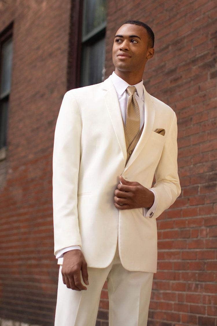 Man holding his suit jacket together in the Wedding Tuxedo Ivory Troy Stephen Geoffrey