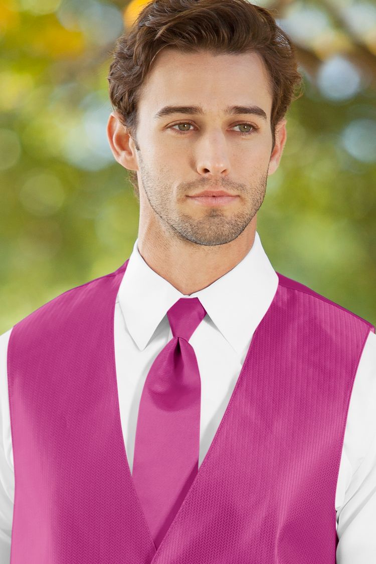 Man wearing the Herringbone Begonia Windsor Tie with a matching vest