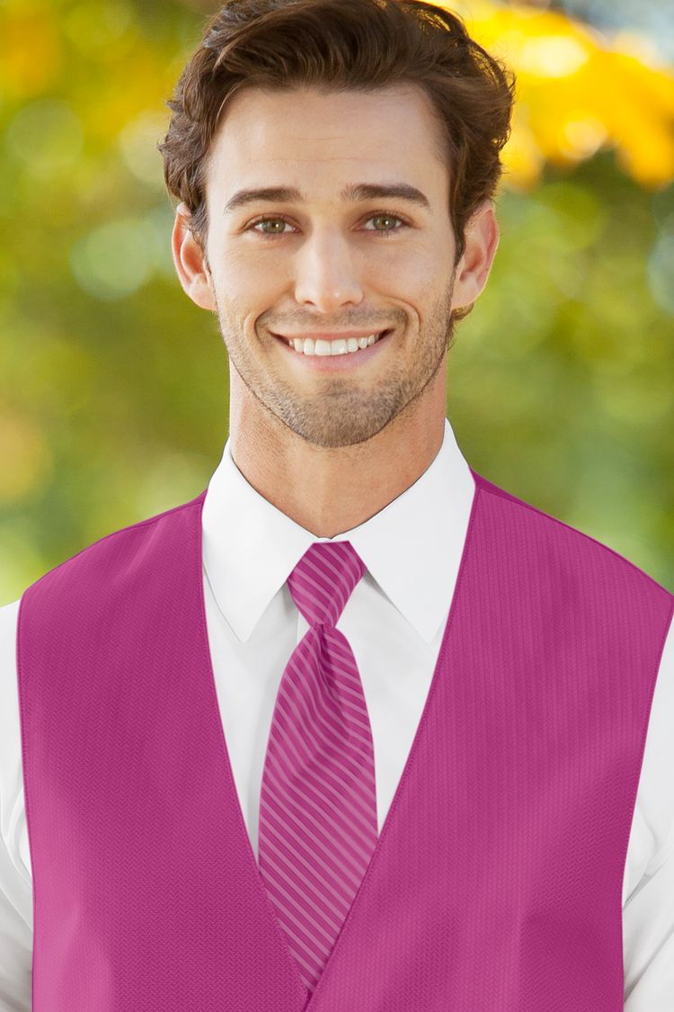 Man wearing the Herringbone Begonia Windsor Tie with a matching vest