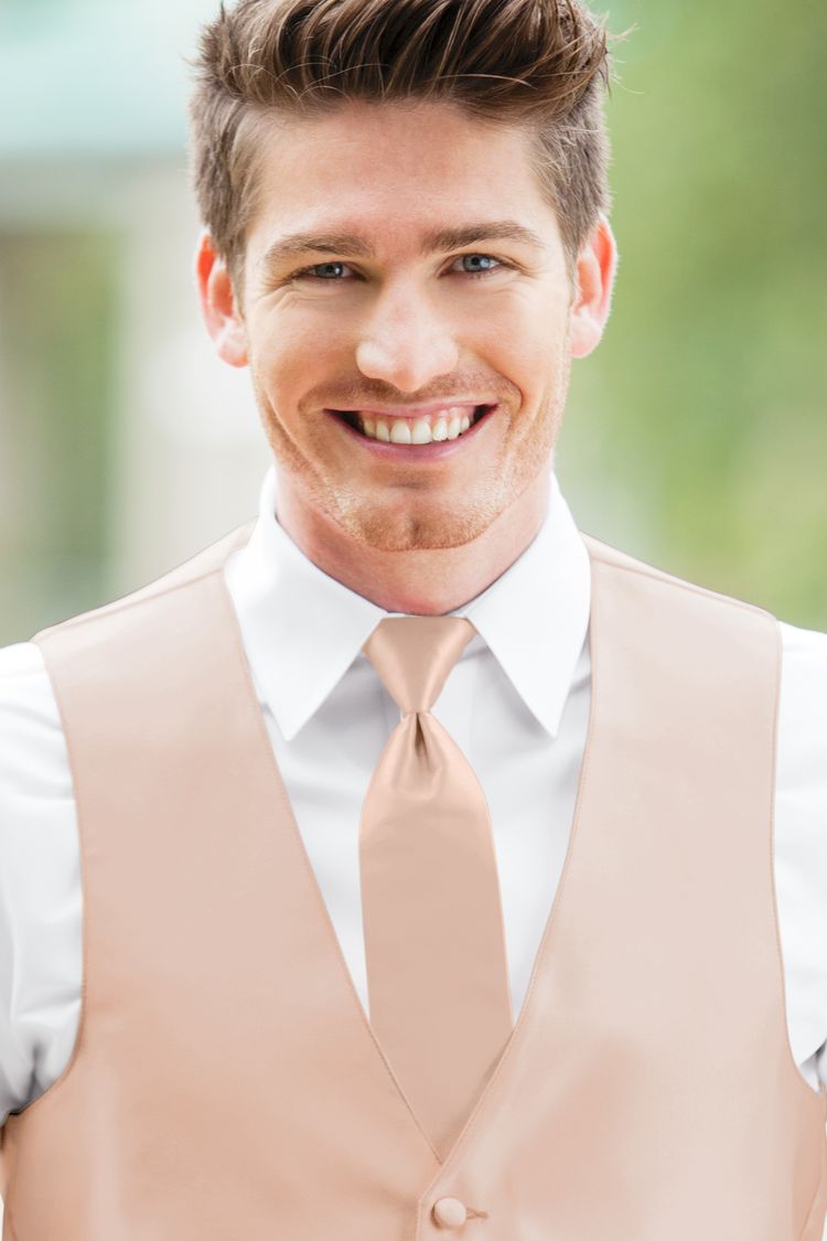Man wearing the Expressions Blush Windsor Tie with a matching vest
