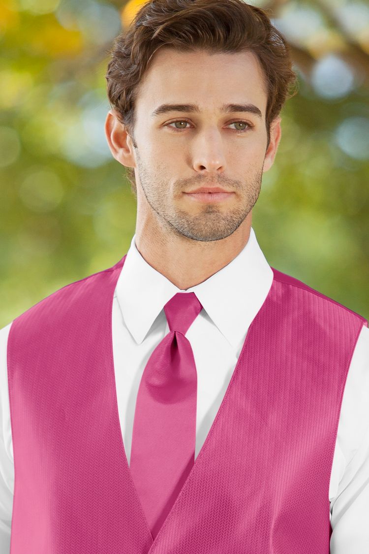 Man wearing the Herringbone Bright Fuchsia Windsor Tie with a matching vest