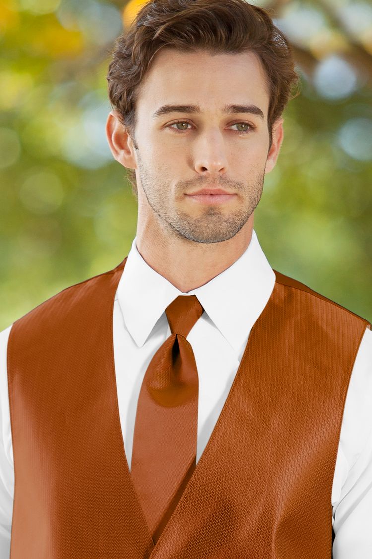 Man wearing the Herringbone Burnt Orange Windsor Tie with a matching vest
