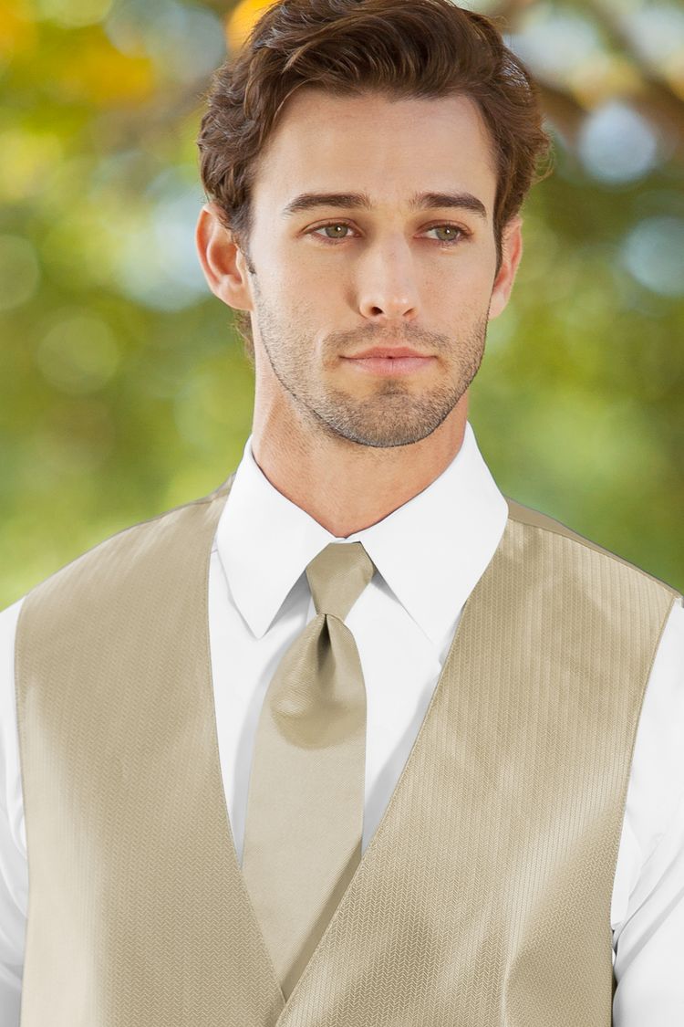 Man wearing the Herringbone Champagne Windsor Tie with a matching vest