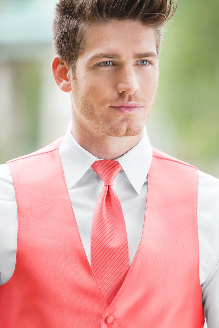 Man wearing the Expressions Dark Coral Windsor Tie with a matching vest