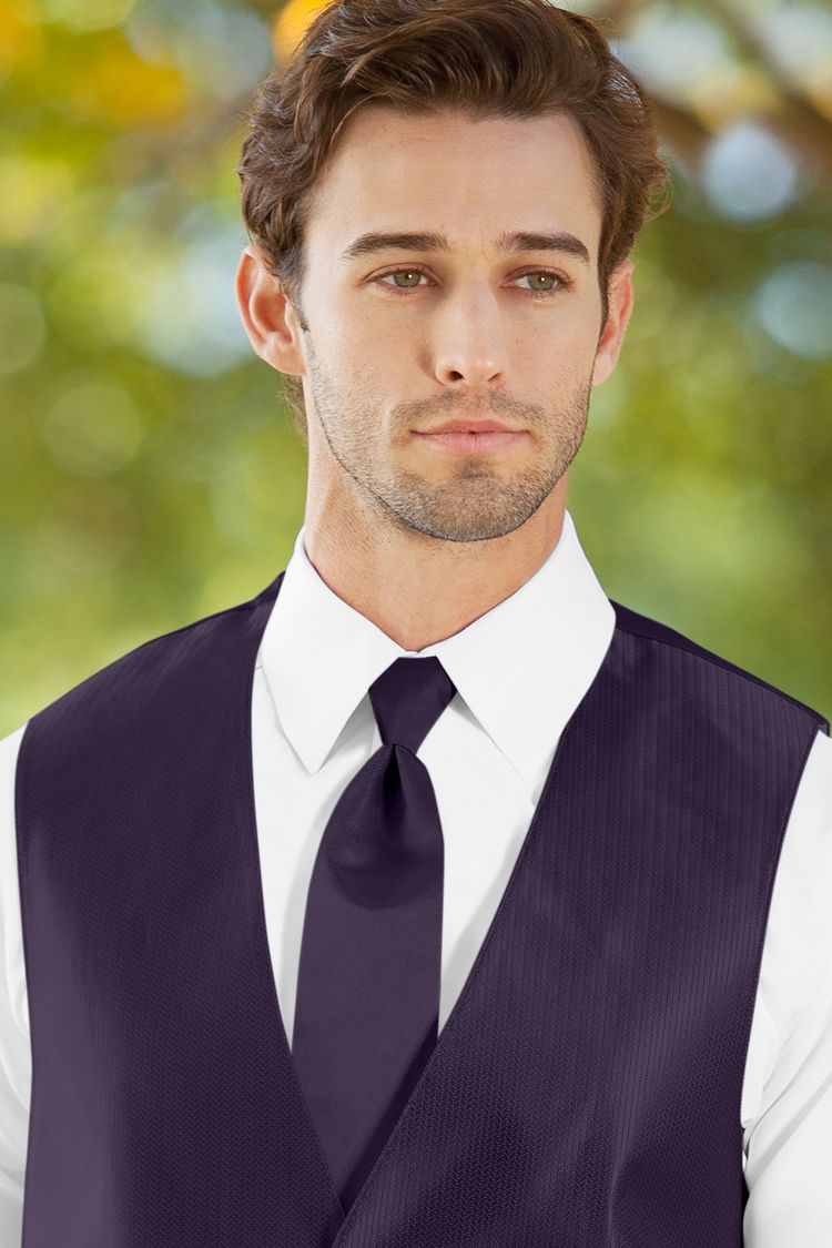 Man wearing the Herringbone Eggplant Windsor Tie with a matching vest