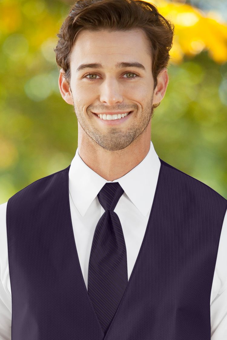 Man wearing the striped Herringbone Eggplant Windsor Tie with a matching vest