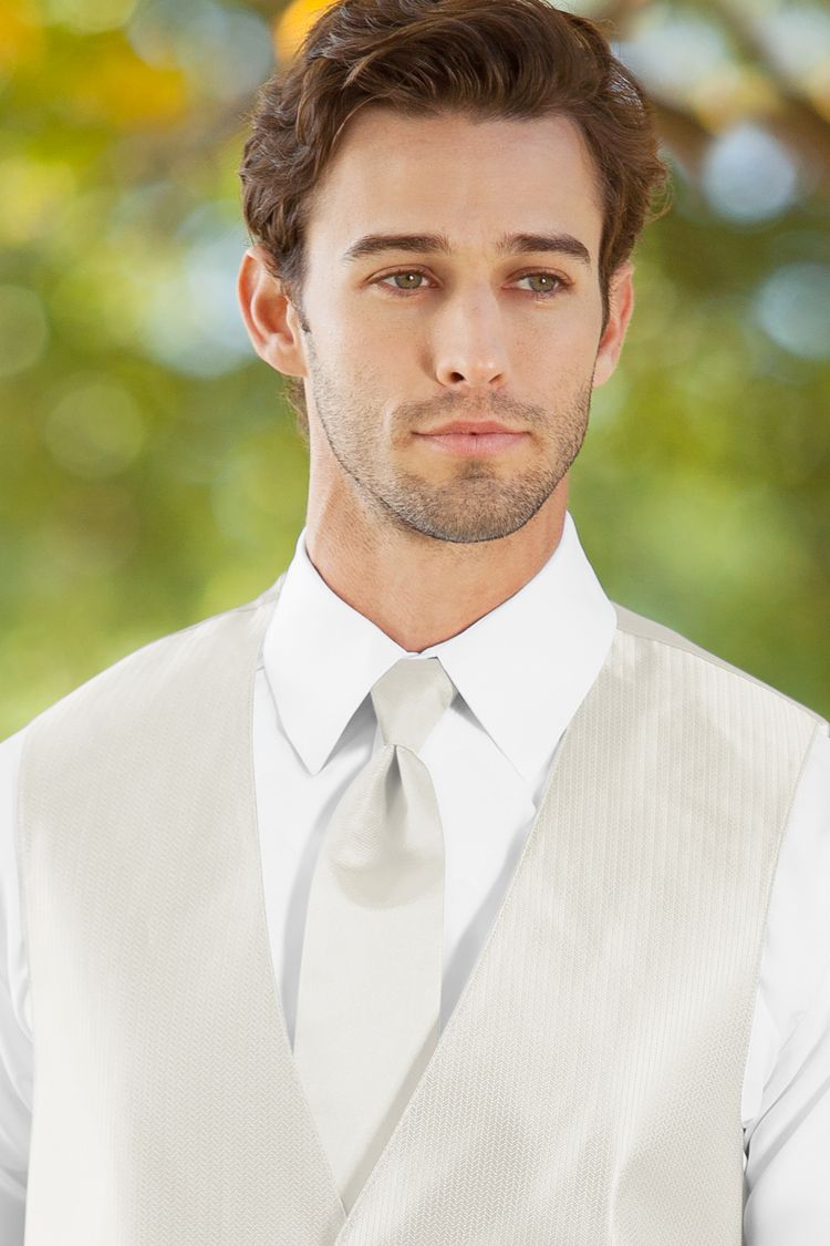 Man wearing the Herringbone Ivory Windsor Tie with a matching vest