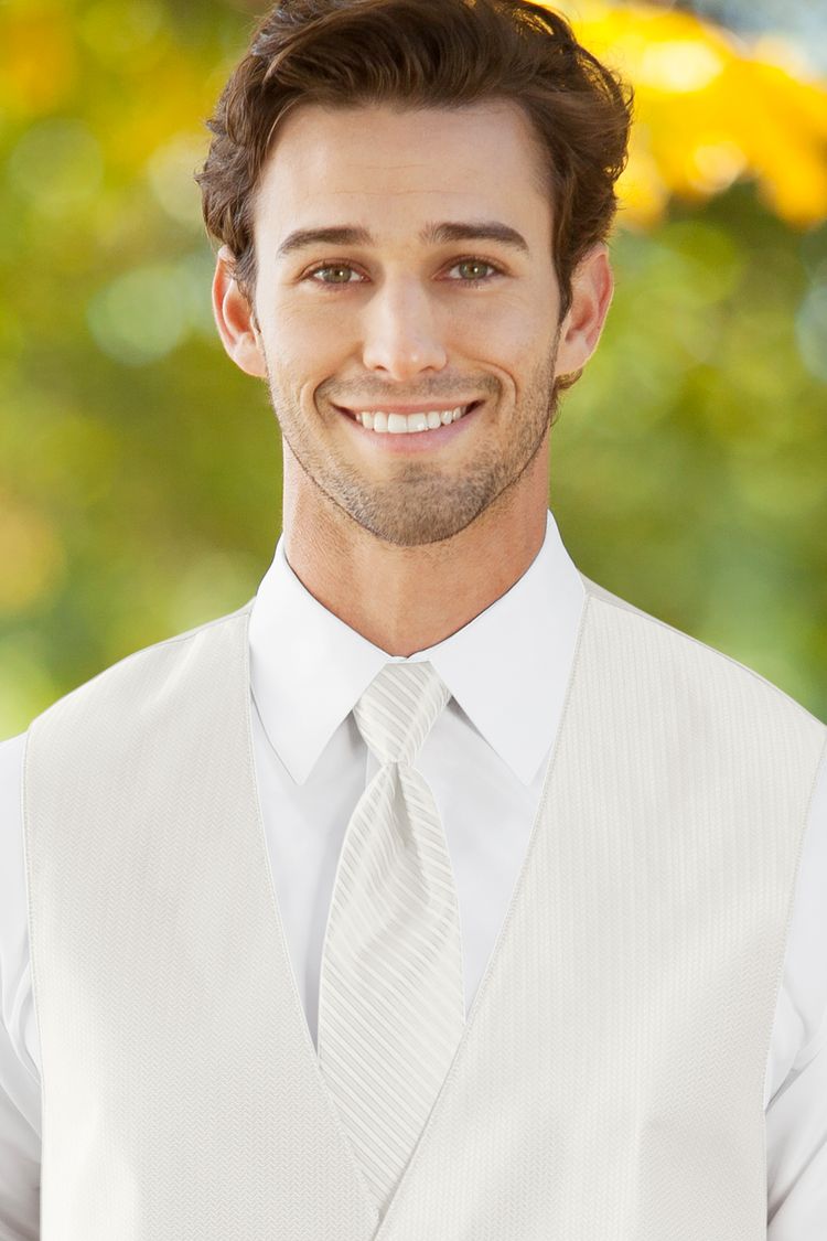 Man wearing the striped Herringbone Ivory Windsor Tie with a matching vest