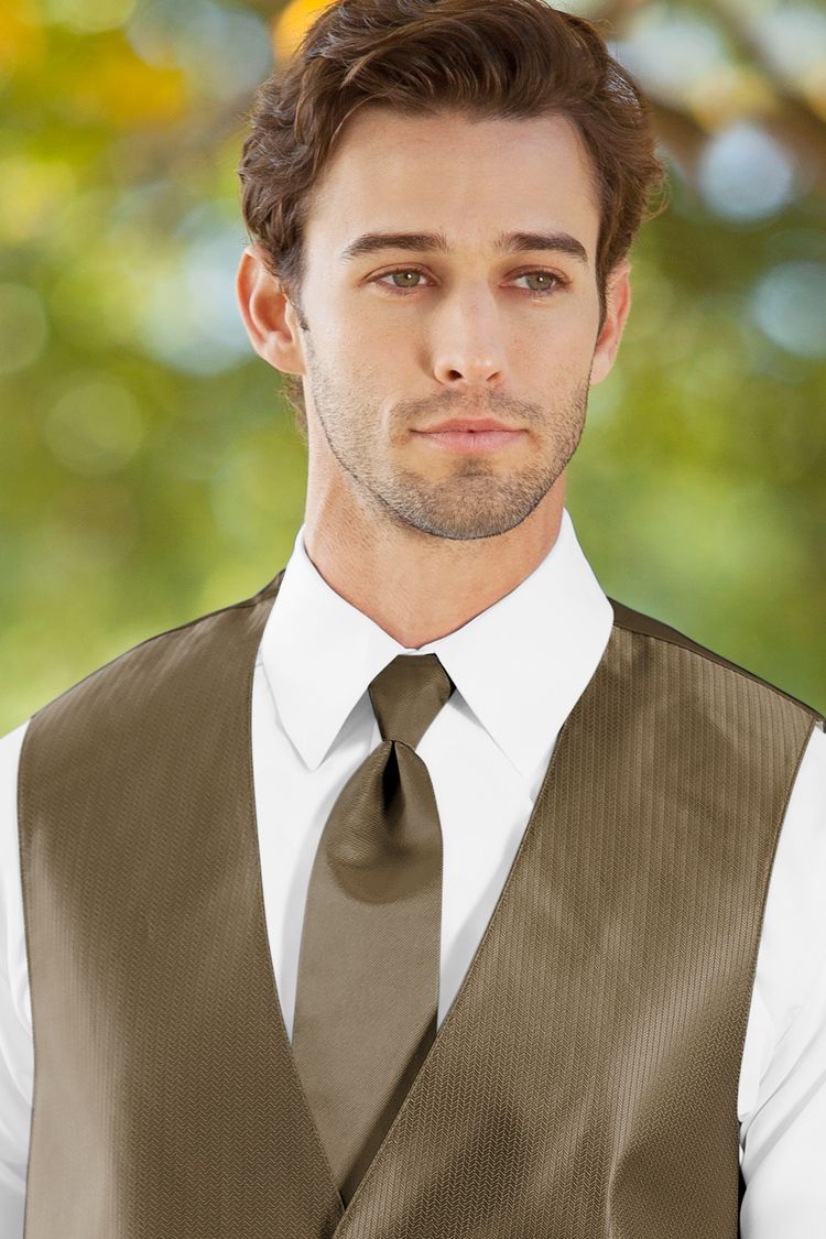 Man wearing the Herringbone Latte Windsor Tie with a matching vest