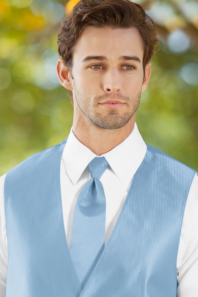 Man wearing the Herringbone Lite Blue Windsor Tie with a matching vest