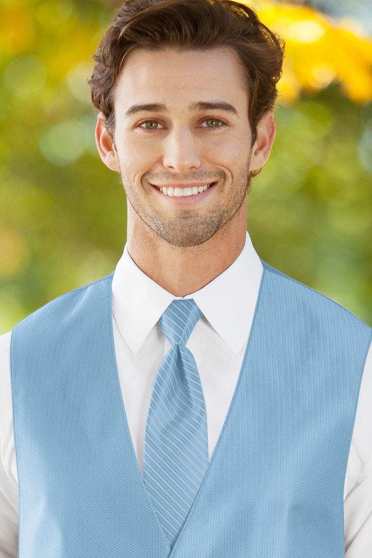 Man wearing the striped Herringbone Lite Blue Windsor Tie with a matching vest