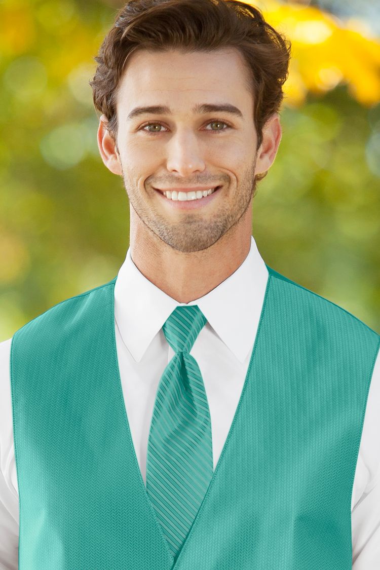 Man wearing the striped Herringbone Mermaid Windsor Tie with a matching vest