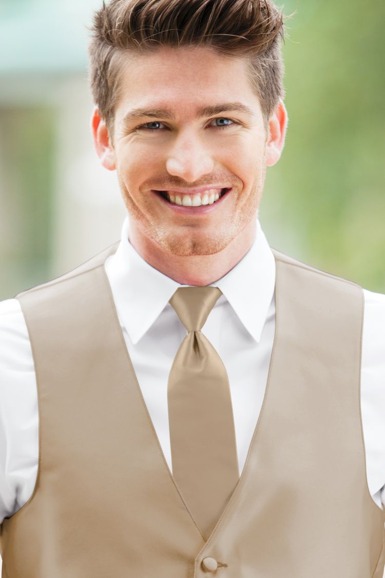 Man wearing the Expressions Nude Windsor Tie with a matching vest