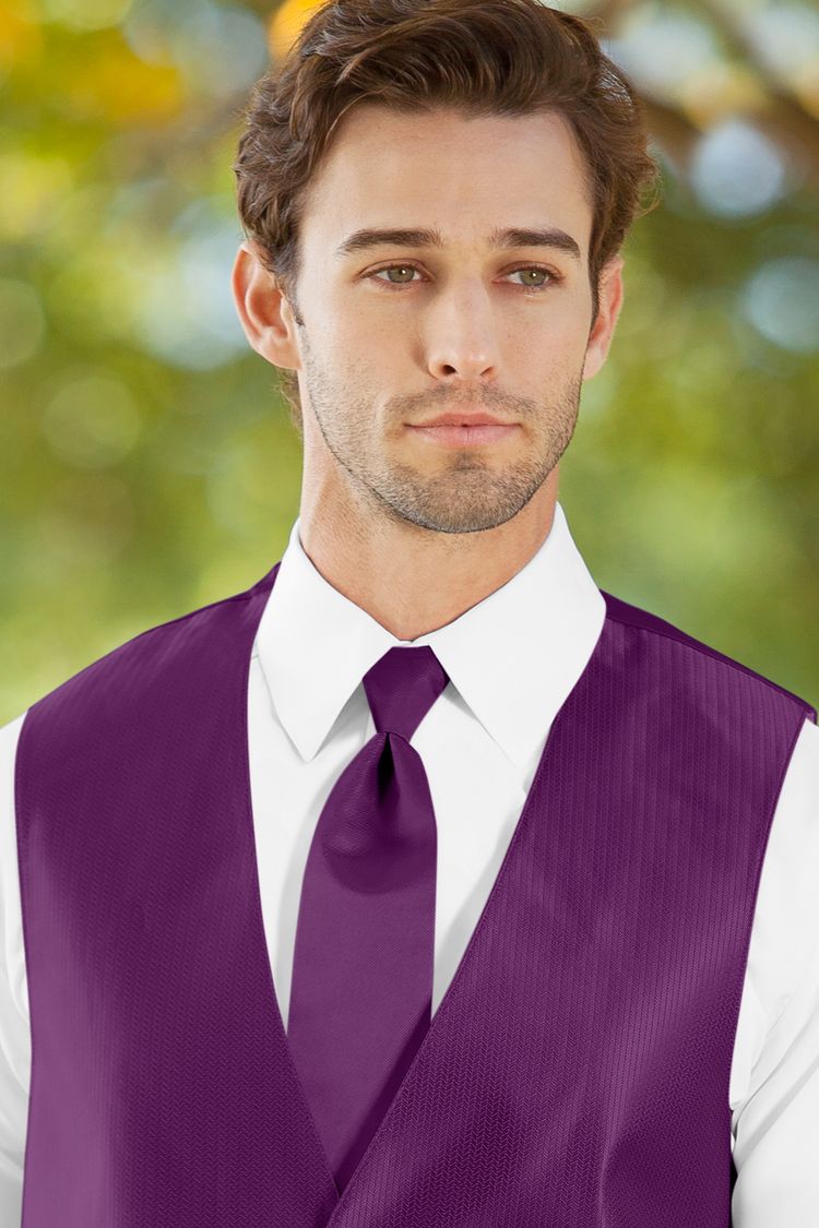 Man wearing the Herringbone Persian Plum Windsor Tie with a matching vest