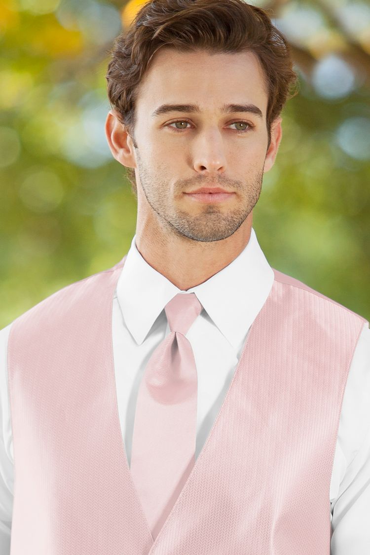 Man wearing the Herringbone Petal Pink Windsor Tie with a matching vest