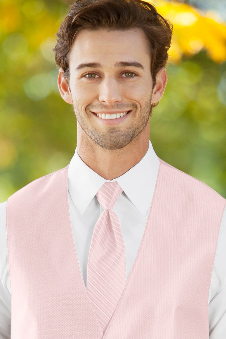 Man wearing the striped Herringbone Petal Pink Windsor Tie with a matching vest
