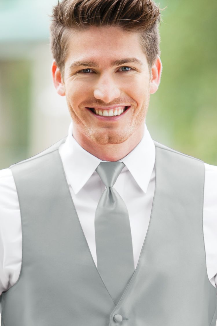 Man wearing the Expressions Platinum Windsor Tie with a matching vest