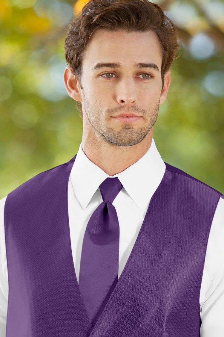 Man wearing the Herringbone Purple Windsor Tie with a matching vest