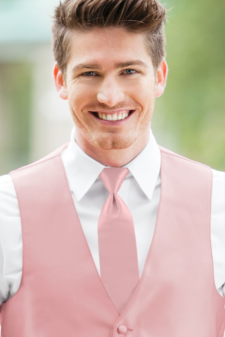 Man wearing the Expressions Rose Petal Windsor Tie with a matching vest