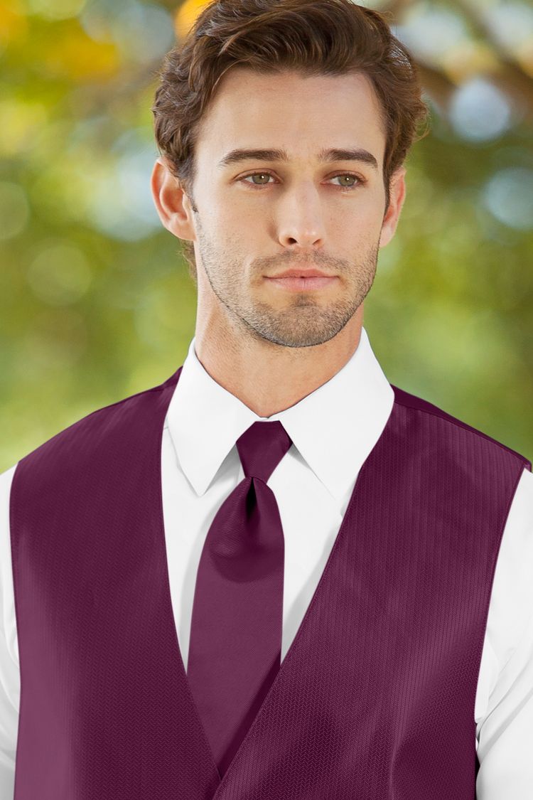 Man wearing the Herringbone Sangria Windsor Tie with a matching vest