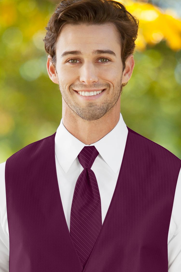 Man wearing the striped Herringbone Sangria Windsor Tie with a matching vest