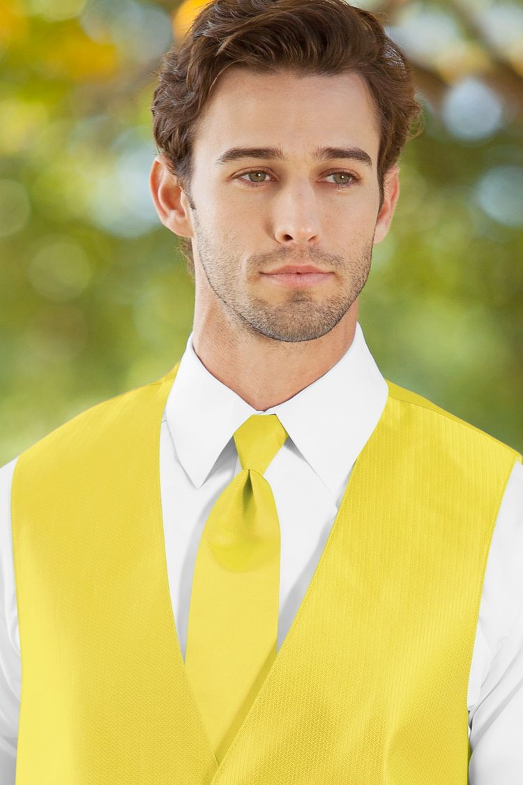 Man wearing the Herringbone Sunbeam Windsor Tie with a matching vest