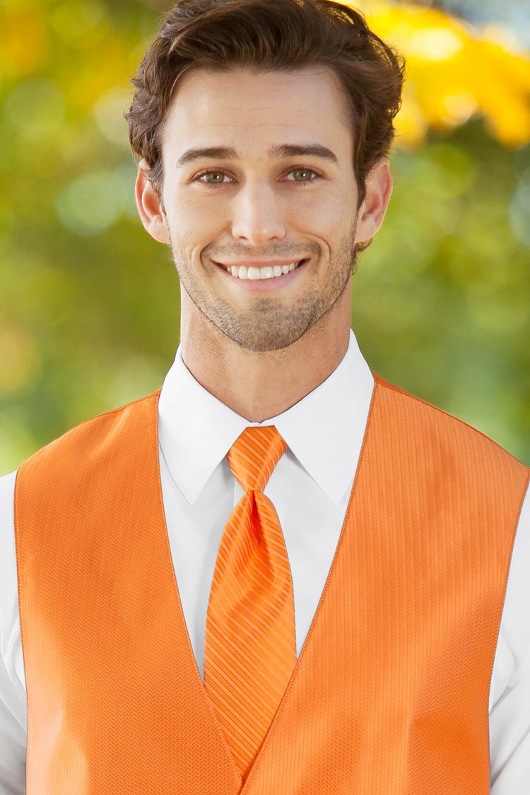 Man wearing the striped Herringbone Tangerine Windsor Tie with a matching vest