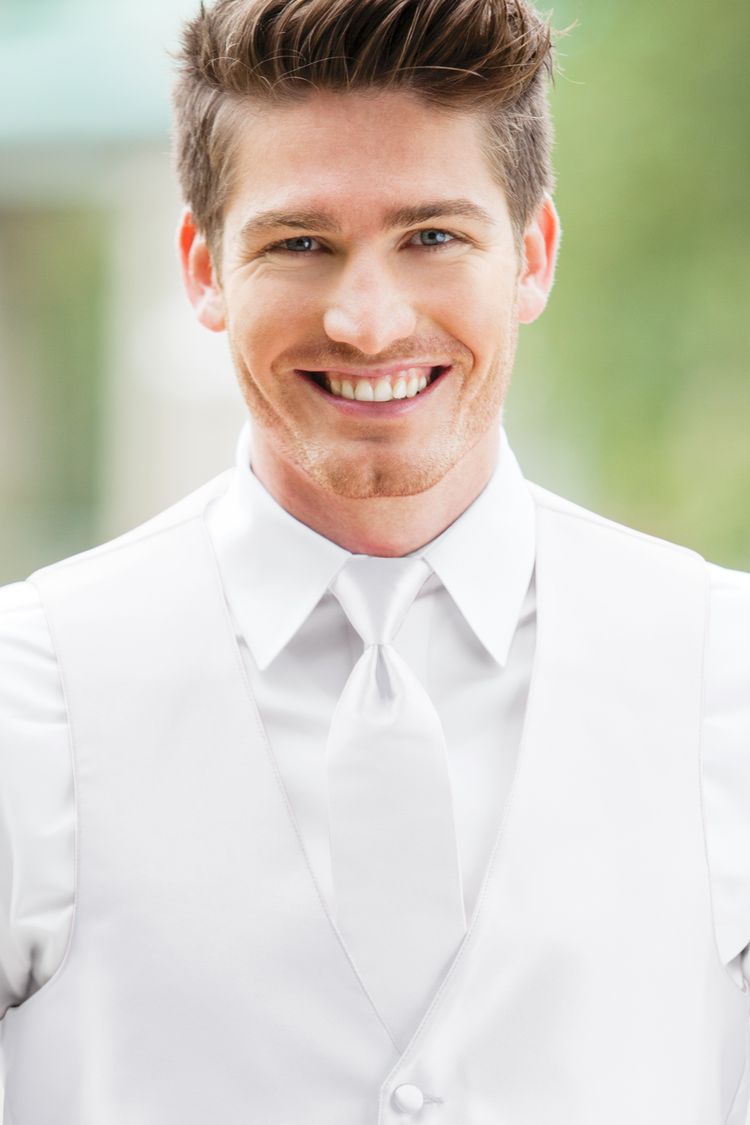 Man wearing the Expressions White Windsor Tie with a matching vest
