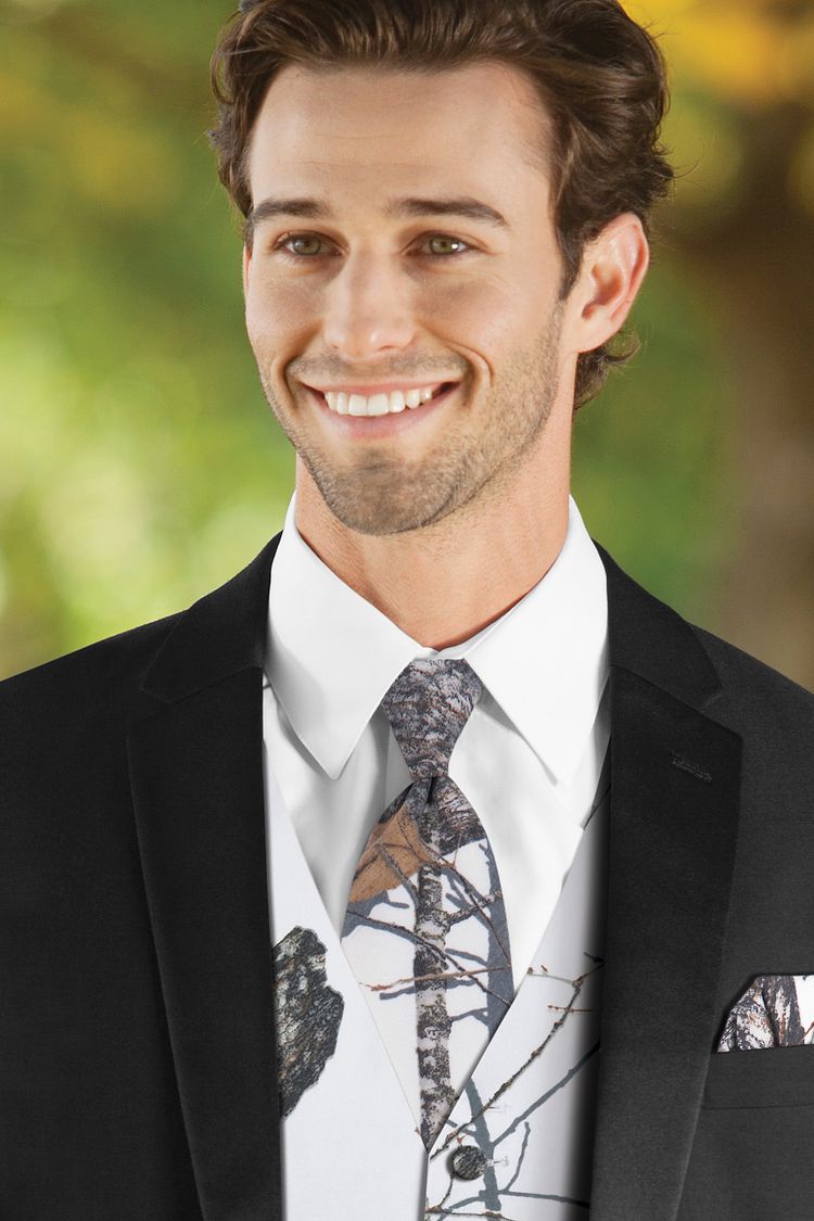Man wearing the Mossy Oak White Camouflage Windsor Tie with a matching vest
