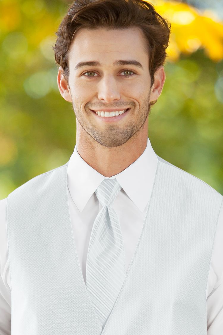 Man wearing the striped Herringbone White Windsor Tie with a matching vest