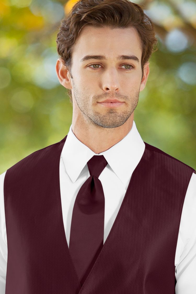 Man wearing the Herringbone Wine Windsor Tie with a matching vest